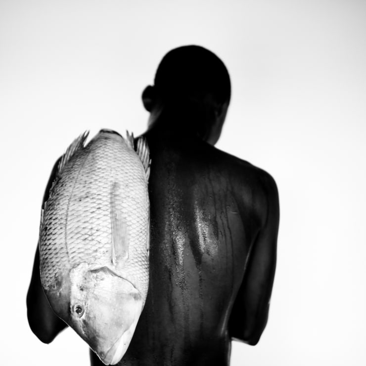 Mario Macilau, Boy with a fish II, from 'Faith' series, 2022