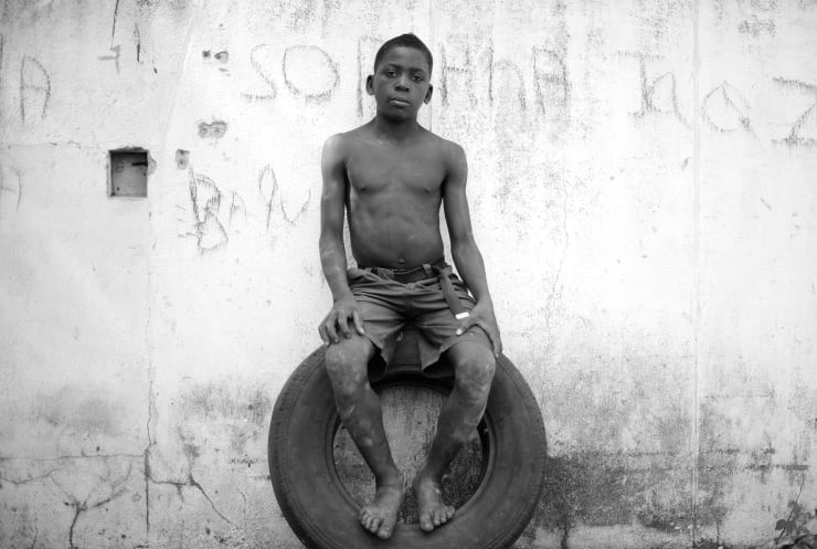 Mário Macilau, Sitting on a Tyre, Growing in Darkness series, 2012