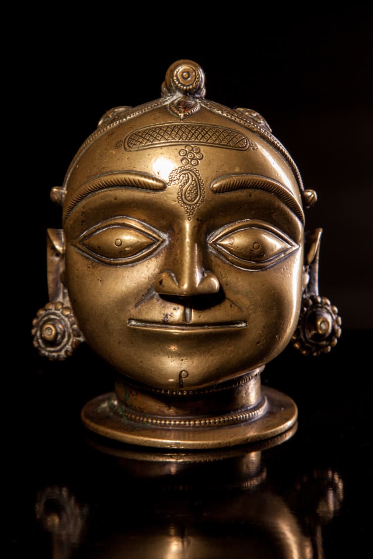 A Brass Head with Plaited Topknot