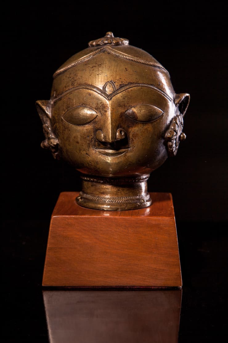 A Bronze Head with Flowerhead Topknot