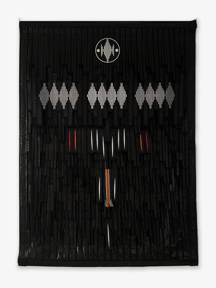 Tapestry made from black fabrics by Malian artist Abdoulaye Konaté and inspired by Ivory Coast. GALERIE FARAH FAKHRI
