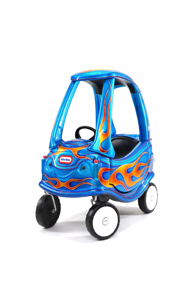photo of a blue childrens car with painted flames