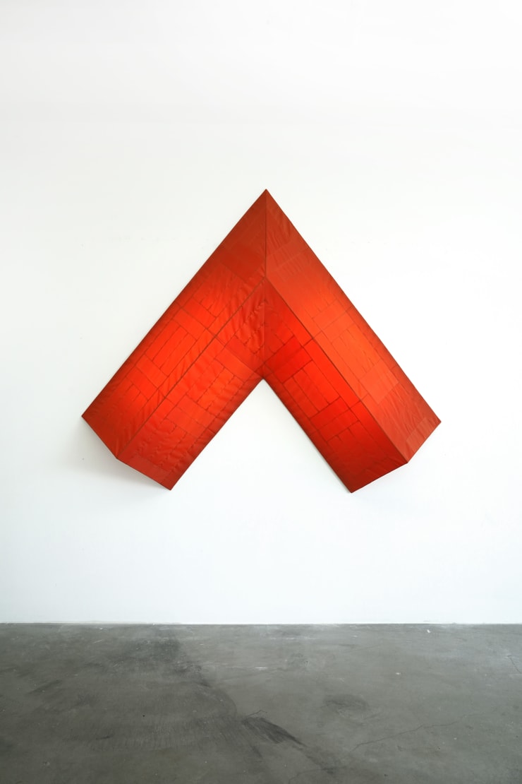 red arrow wall lamp mounted on a white wall