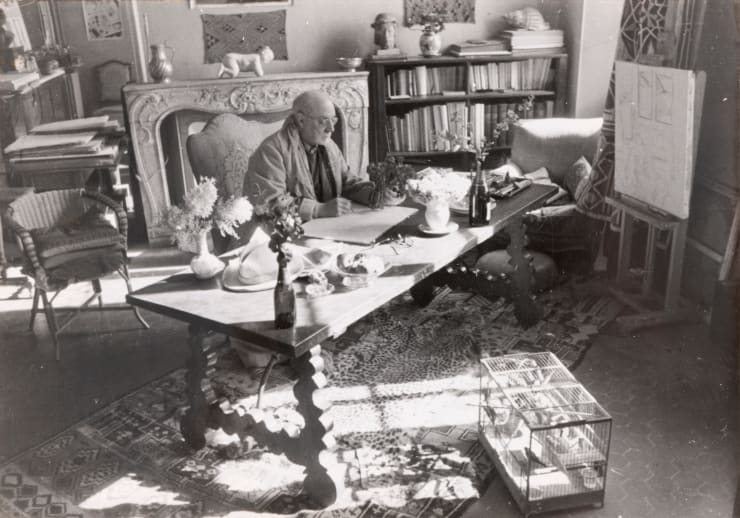 Henri Matisse drawing at his desk. Villa "Le Rêve", Vence, February 1944