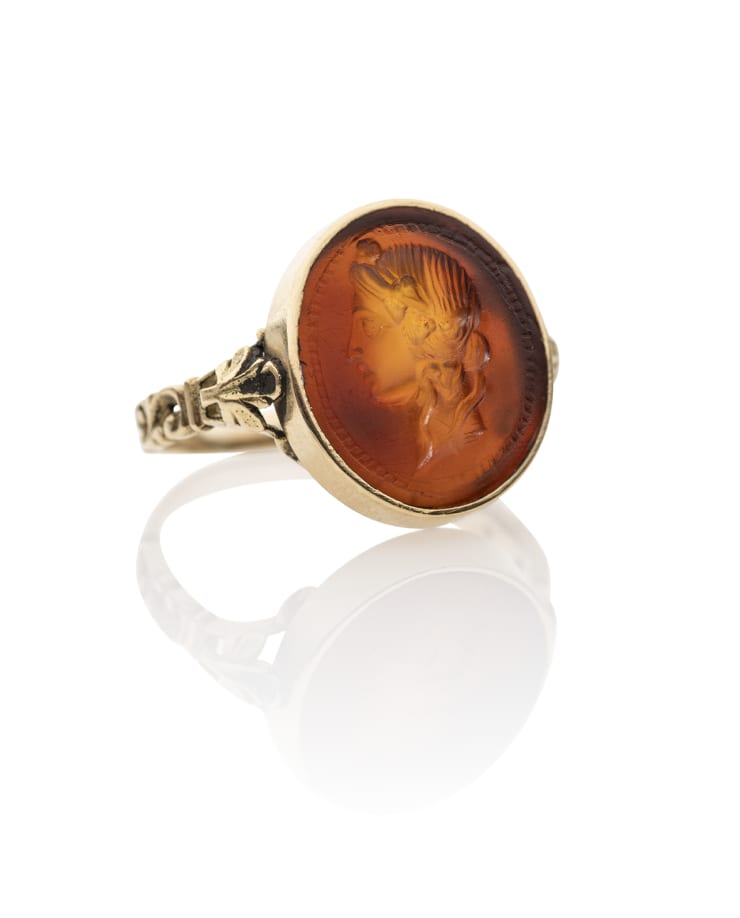 Roman, A Roman carnelian intaglio of a head of Dionysus set in an antique gold ring, Republican, circa 1st century BC