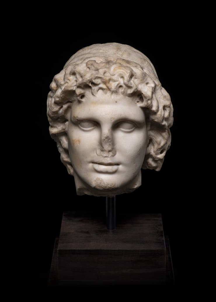 Roman, A Roman marble head of Alexander the Great as Helios, circa 2nd century AD
