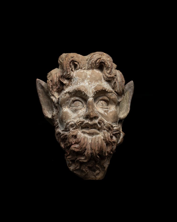 Greek, A Greek terracotta head of Pan, Hellenistic, circa 3rd century BC