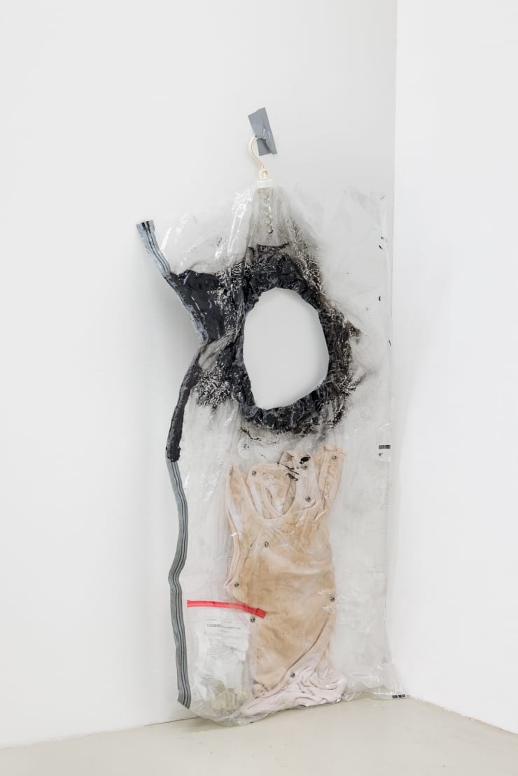 Allen-Golder Carpenter Untitled (Vacuum seal bag), 2023 Vacuum seal warmed bag, Cotton shirt, Rivets, Simulated evidence bag containing a shattered glass bottle 60 x 145 cm 23 5/8 x 57 1/8 in