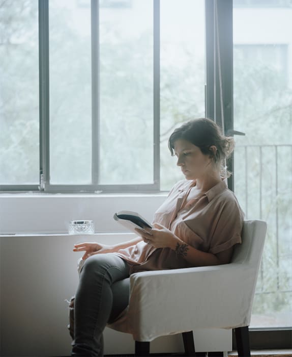 Carrie Schneider Flávia reading Clarice Lispector (Clarice na Cabeceira, pub. 2009) from the series Reading Women (2012-2014), 2014 C-print 36 x 30 in. 91.44 x 76.2 cm Edition of 5 plus 2 artist's proofs