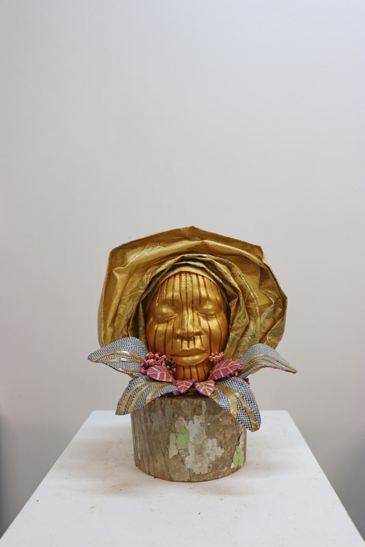 Layo Bright Mrs Thorpe's Dad's Celebration of Life, 2021 Ghana-Must-Go bag, gele, ceramic, pigment, wood, acrylic Sculpture: 17 x 16 x 15 in Sculpture + plinth: 70 x 22 x 22 in
