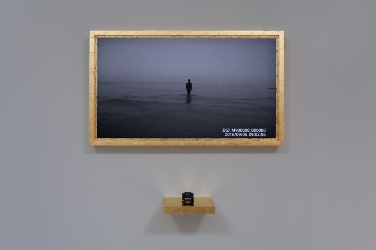 Cheryl Pope PORTRAIT OF A YOUNG MAN, in Collaboration with Spencer Hopkins, 2016 HD video recorded on police body camera in custom wood frame with 23K gold leaf, policy body camera on wood shelf with 23K gold leaf 23 1/2 x 39 x 3 3/4 in. 59.7 x 99.1 x 9.5 cm Notes: Video duration: 18 min loop Shelf dimensions: 3 1/2 x 10 x 10 inches Overall dimensions: 36 x 39 1/2 10 inches Edition of 3