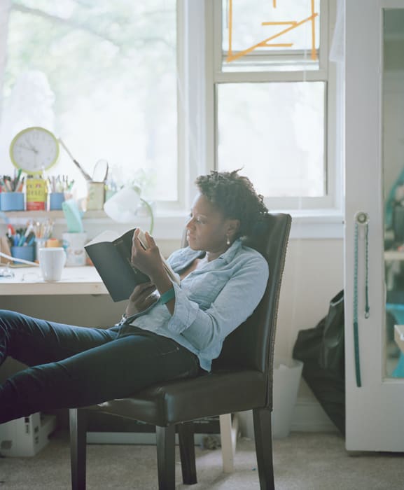 Carrie Schneider Cauleen reading Gwendolyn Brooks (Blacks, pub. 2008) from the series Reading Women (2012-2014), 2014 C-print 36 x 30 in. 91.44 x 76.2 cm Edition of 5 plus 2 artist's proofs