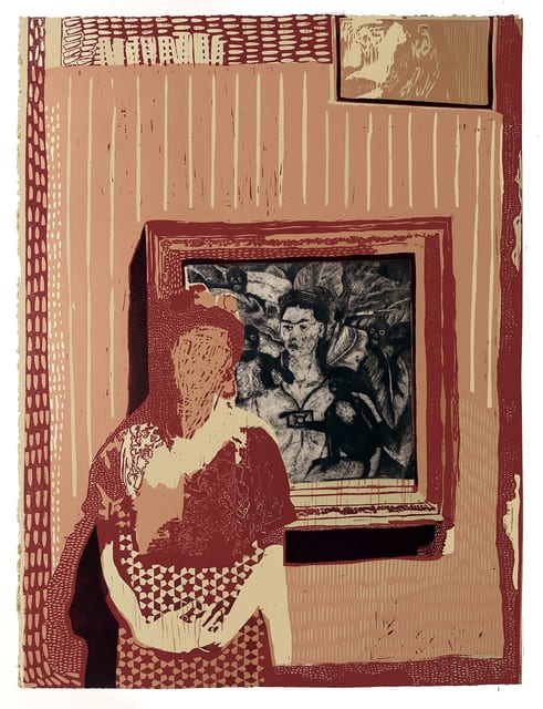 Woman dressed as Frida in front of Frida Kahlo self-portrait