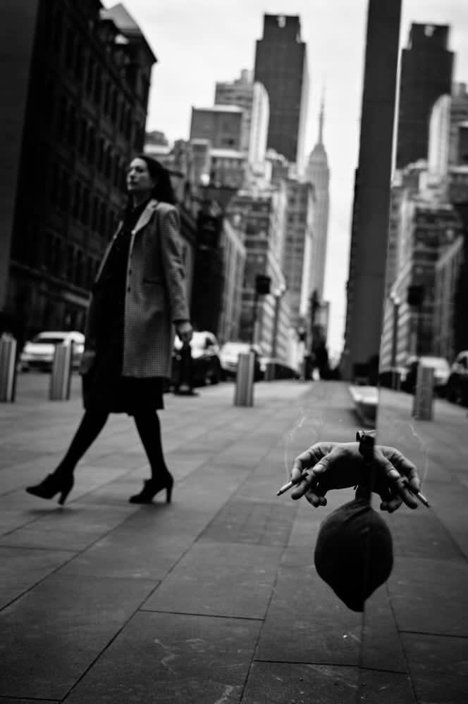 PHIL PENMAN, CIGARETTE SMOKING IN MIDTOWN, NEW YORK, 2023