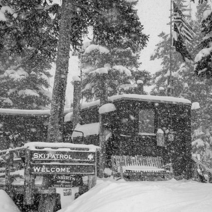Black and white photo of a Ski Patrol shack in Telluride in the snow by Slate Gray Gallery Artist Brett Schreckengost