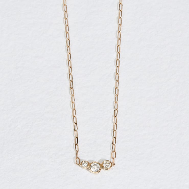 14k yellow gold, asymmetrical bezel set round diamond necklace by Fringe Gallery studio jeweler Jane Pope