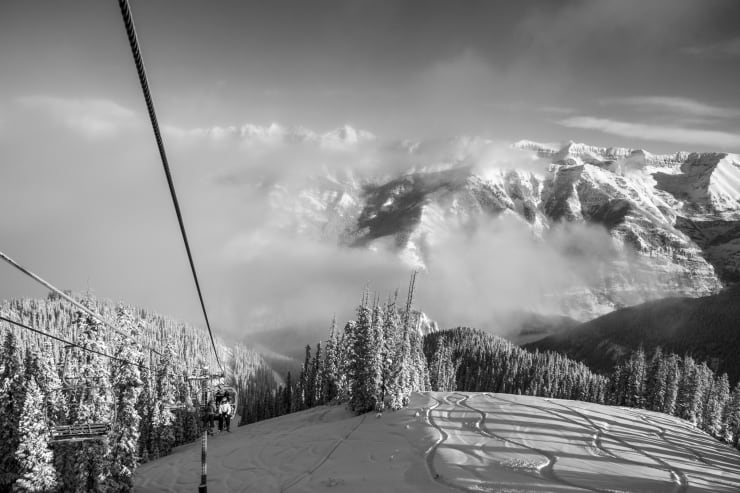Black and white photo of a view from a ski lift by Slate Gray Gallery photographer Brett Schrekengost