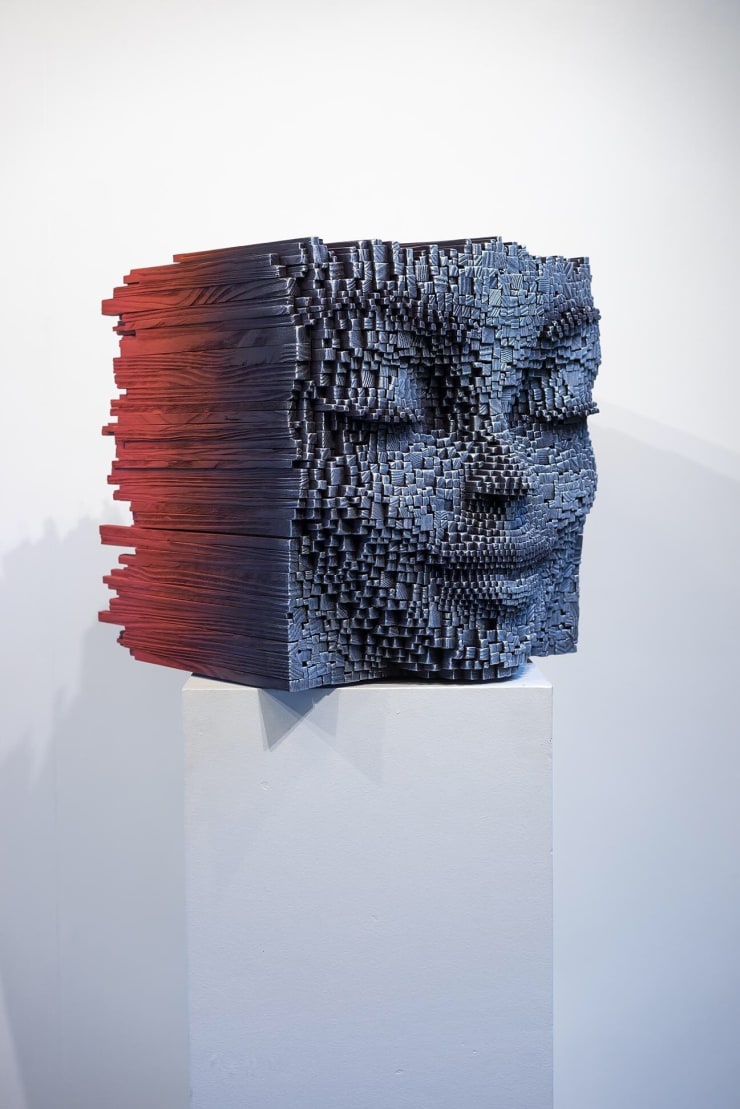 "Sphinx" a sculpture of a face made from wooden sticks and paint by slate gray gallery artist Gil Bruvel