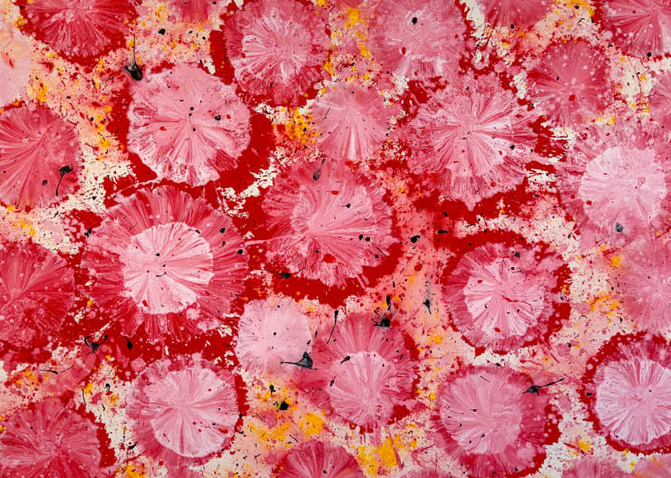 Jorge Luis Santos painting with black and yellow spots