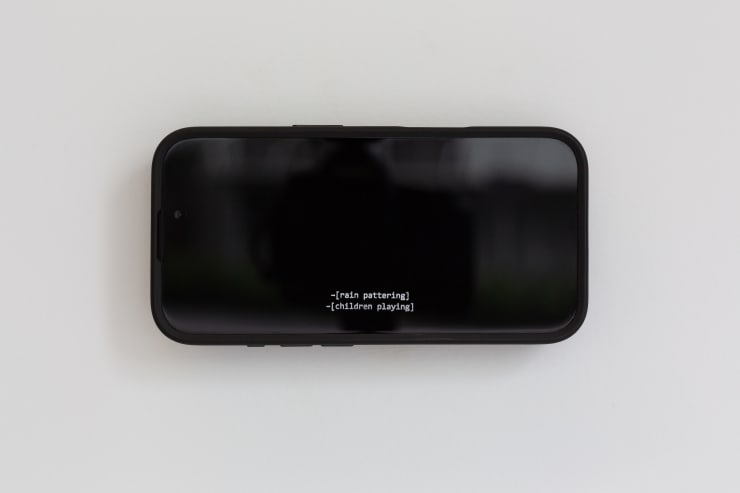 Matthew Galloway Watch History (-[rain pattering] -[children playing]), 2025 Engraved replica iPhone 16 handset, Quad Lock Mag case and mount 7.5 x 15 x 2 cm 3 x 6 x 3/4 in