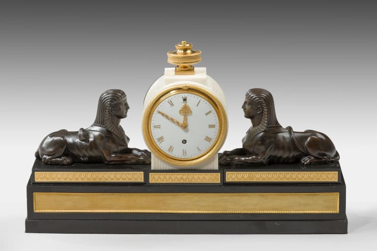 Patinated and Gilt Bronze Mounted Marble Mantel Timepiece