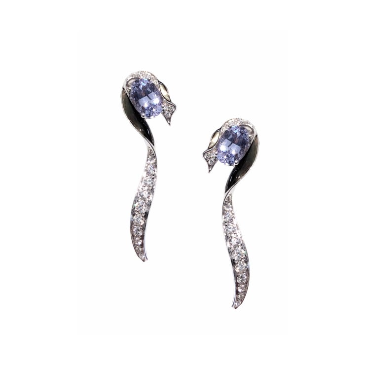 Simone Bombshell: Hidden Gem Earrings Unheated Blue Spinel : 2 - 2.05 carats Black Mother of Pearl : 4 - 0.63 carat Diamonds : 36 - 0.50 carat 18k White Gold