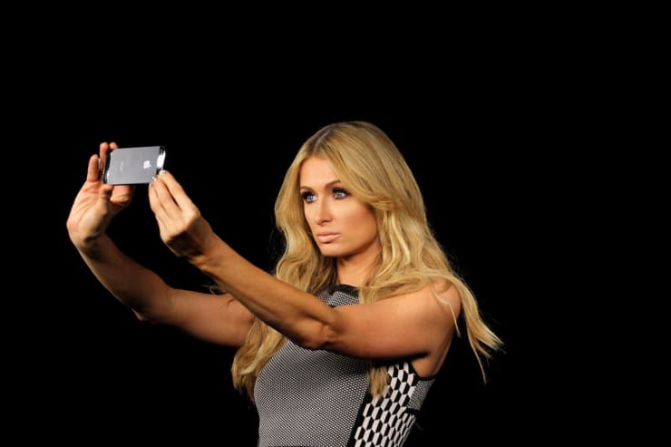 Portrait of Paris Hilton taking a selfie by Pulitzer Prize Recipient Nick Ut