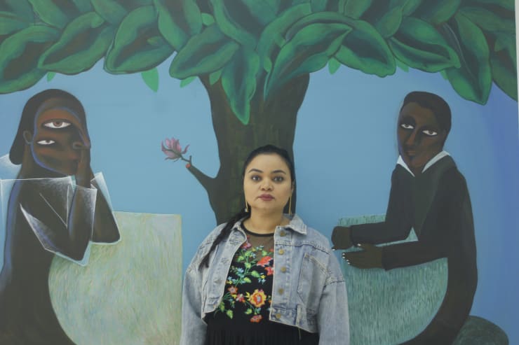 Picture ; Souad standing in front of a painting, Waiting, acrylic on canvas, Behind The River