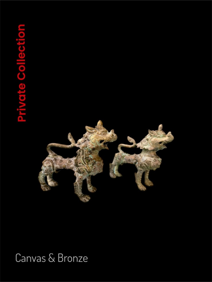 Two intricately designed bronze mythical creatures on a black background, showcasing detailed patterns and a patina finish, reflecting ancient cultural artistry.