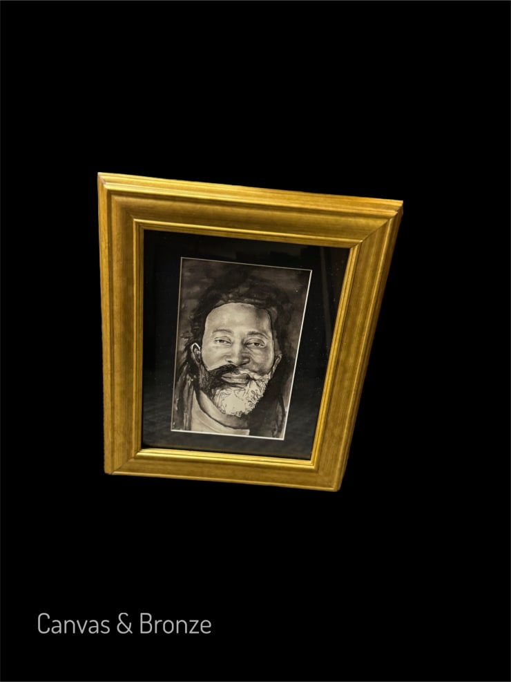 A framed black and white portrait of a bearded man against a black background.