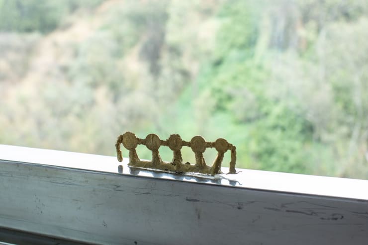 Tania Pérez Córdova Contenidos de un bolsillo: 7 coins 1 key, 2021 Bronze 5 x 20 x 2 cm (2 x 7.9 x 0.8 in)