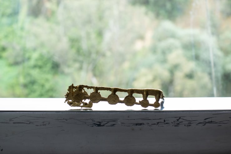 Tania Pérez Córdova Contenidos de un bolsillo: 8 monedas, 2021 Bronze 5 x 20 x 2 cm (2 x 7.9 x 0.8 in)