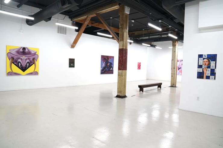 photograph of the gallery with paintings on the walls