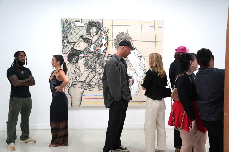 photograph of the gallery with paintings on the walls
