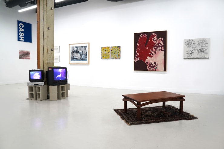 photograph of the gallery with paintings on the walls