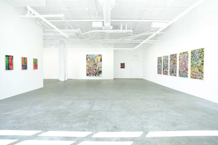 photo of the art gallery with paintings hung on the wall