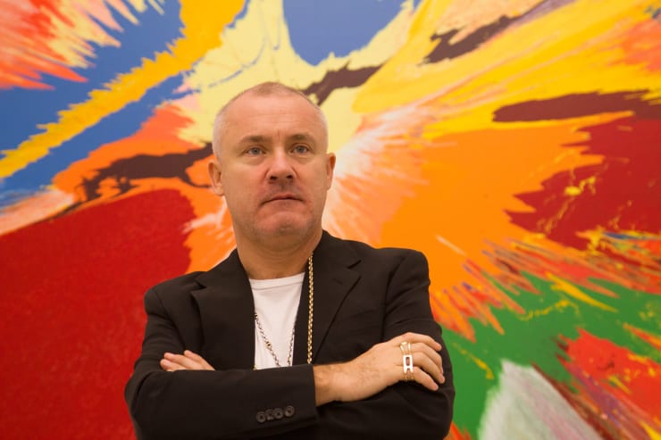 Damien Hirst, Doha 2013 by Gazanfarulla Khan is licensed under CC BY-ND 2.0. Damien Hirst's NFT paintings may or may not go up in flames.