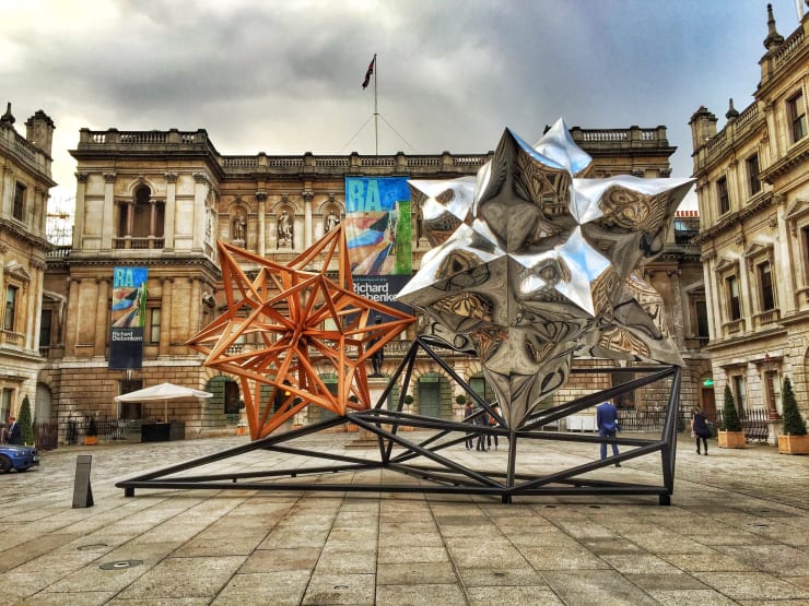 Courtyard sculpture by Frank Stella Hon RA - Royal Academy of Arts - London "Courtyard sculpture by Frank Stella Hon RA - Royal Academy of Arts - London" by pobre.ch is licensed under CC BY 2.0. Taken on April 16, 2015