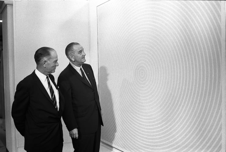 U.S. President Lyndon Baines Johnson and U.S. Senator J. William Fulbright inspect "Squaring the Circle", a bright red 1963 painting by Richard Anuszkiewicz, at the 1965 White House Arts Festival. Image: Public Domain