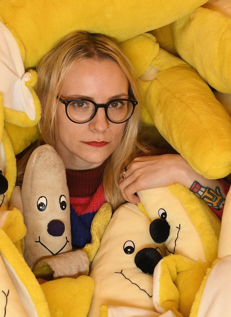 Lucy Sparrow in her 'Banana Room', based in the Sew Your Soul 'Felt HQ' in England, United Kingdom. "Lucy Sparrow and Basil in the Banana Room" by Scott Bradley is licensed under CC BY-SA 4.0 .