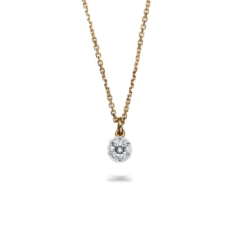 tiny old cut diamond set in platinum in a cut down setting on an 18k yellow gold chain