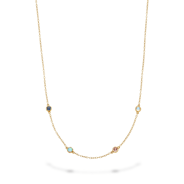 Bespoke Aril Jewels acrostic necklace spelling out COCO on white background