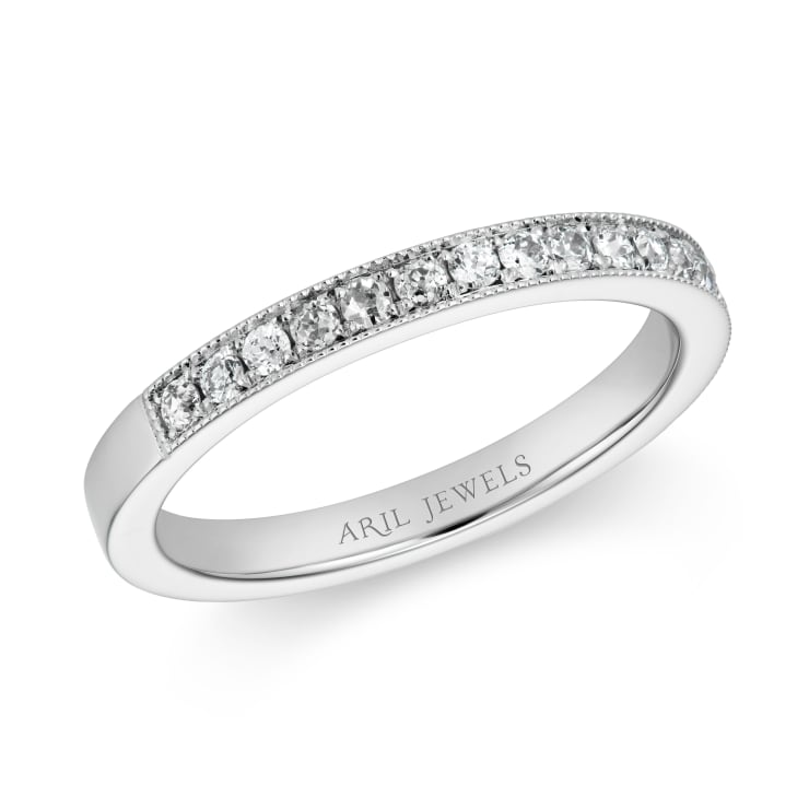 Platinum band and with diamonds set halfway down the band set with millegrain details