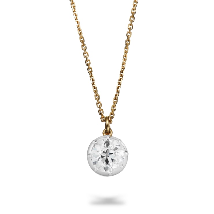 Aril Jewels Georgiana diamond pendant with antique old-cut diamond set in a platinum cut down setting on an 18k yellow gold chain. On white background
