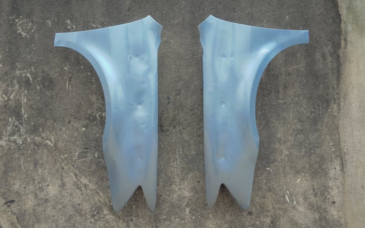 Ugo Ahiakwo Car fenders of a Toyota Avalon wood, roofing sheets (/ "Brazil boards"), mirrors, auto paint, screws, matte and glossy lacquer 44.5" x 9" x 24"