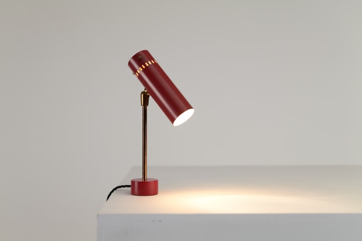 A Red Tito Agnoli Articulating Desk Lamp, 1956. Aluminium, Cast Iron, Brass. Made by O-Luce, Italy.