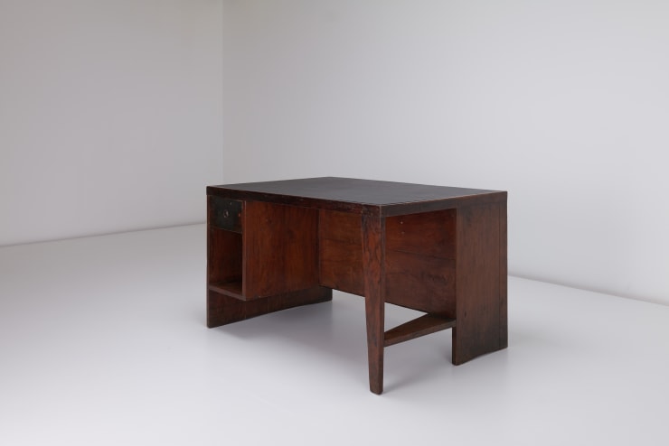 A vintage Pierre Jeanneret pigeonhole desk in Indian rosewood with inset leather top. Made for the modernist brutalist city of Chandigarh to be used in various government buildings. The chair show great depth of patina and are in fully restored condition.