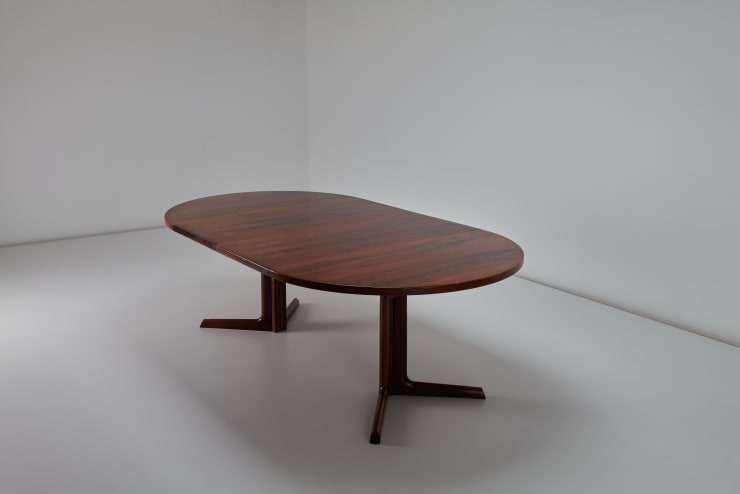 Niels Moller Dining Table, 1970s Bookmatched brazilian rosewood veneer top with solid rosewood legs and banding. Produced by Gudme Mobelfabrik, Denmark. Diagonal view