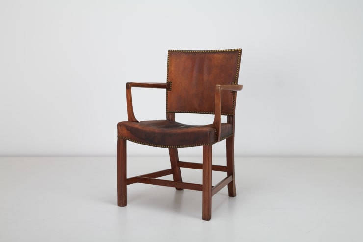 Kaare Klint , Armchair, 1927 Kaare Klint Armchair, 1927 Cuban Mahogany, Niger Leather, Brass Studs Model 3758a - The Red Chair Produced by Rud Rasmussen c1940s. Diagonal view