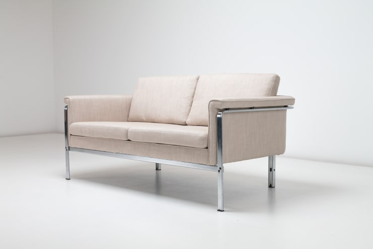 A White Horst Bruning, Sofa Model 6912, 1967. Brushed steel frame with natural linen upholstery, pictured diagonally